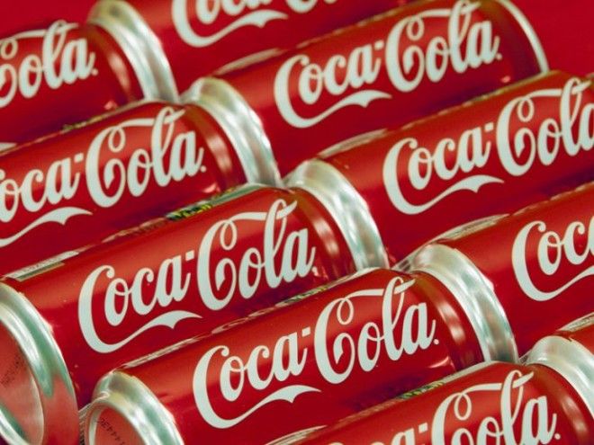 FILE This July 15 2013 file photo shows cans of CocaCola in Doral Fla CocaCola is taking on obesity this time with an online video showing how fun it could be to burn off the 140 calories in a can of its soda AP PhotoWilfredo Lee File